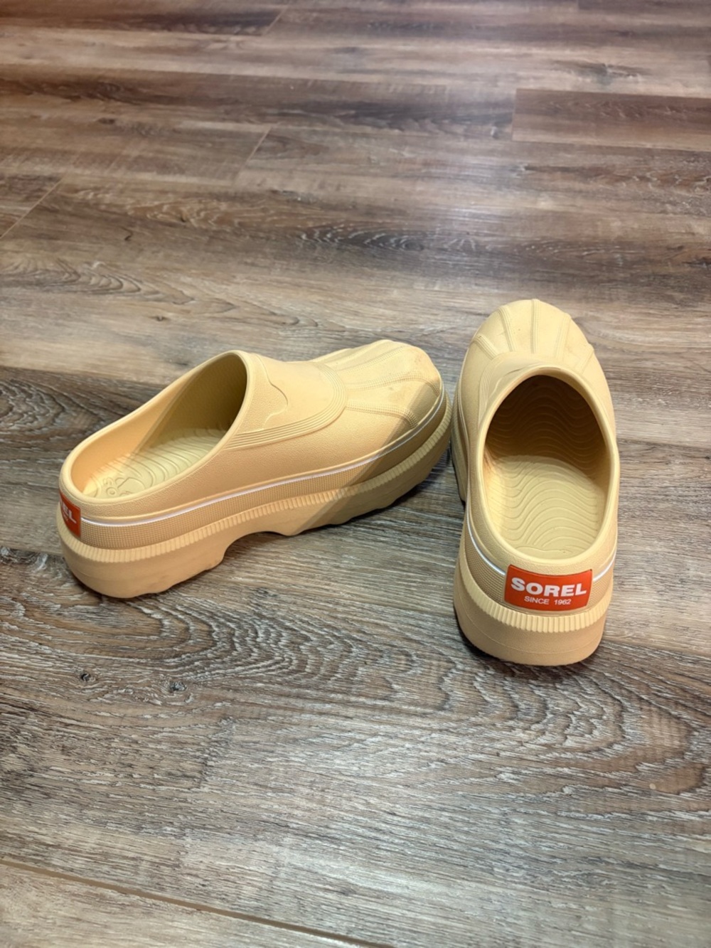 Sorel Cream Yellow Slip-On Clogs with Orange Logo